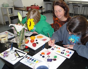 Artist Christine Elder with 7th grade students.