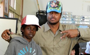 K-Dub with student trying on his primed hat.