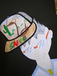Hat drawings were cut out, and self-portraits were added.